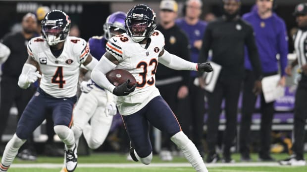 Nov 27, 2023; Minneapolis, Minnesota, USA; Chicago Bears cornerback Jaylon Johnson (33) returns an interception as safety Eddie Jackson (4) looks on against the Minnesota Vikings during the second quarter at U.S. Bank Stadium. Mandatory Credit: Jeffrey Becker-USA TODAY Sports